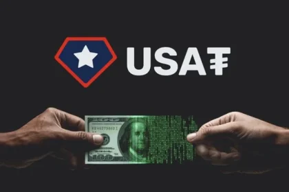 two hands holding a 100 dollar bill and USA₮ written above it