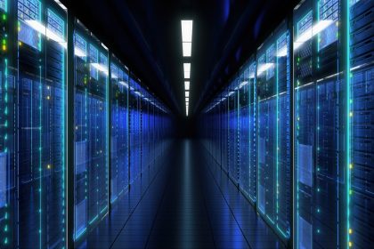 Computers are illuminating a walkway inside a data center.