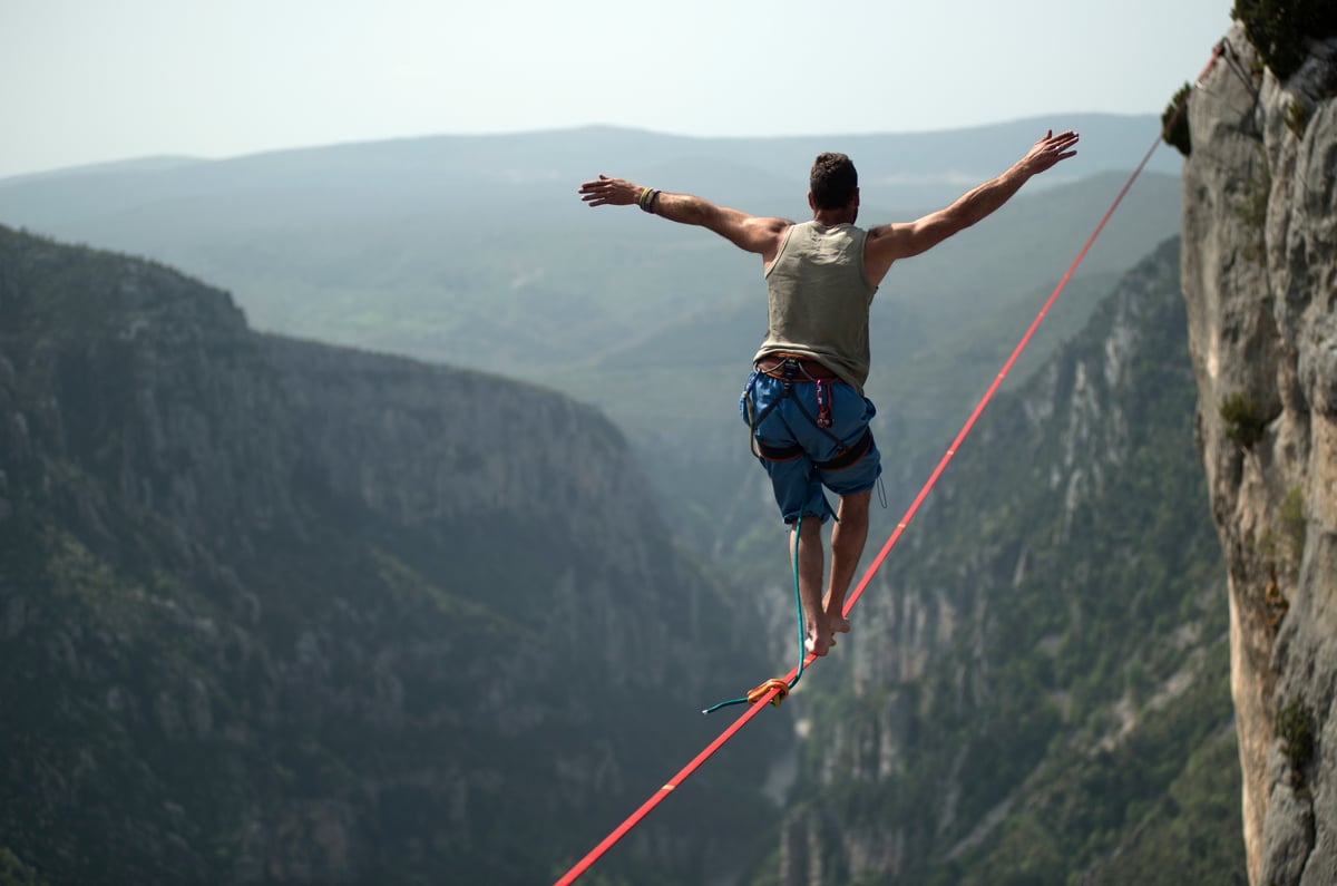 A person walking on a tightrope.
