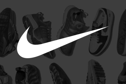 The Nike Swoosh logo on a dark filter with shoes in background.