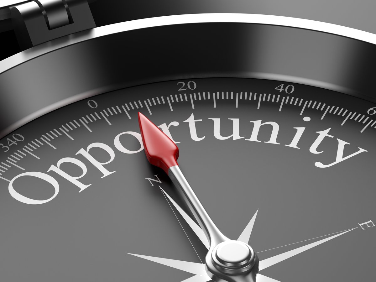 A compass witht he word opportunity in it.