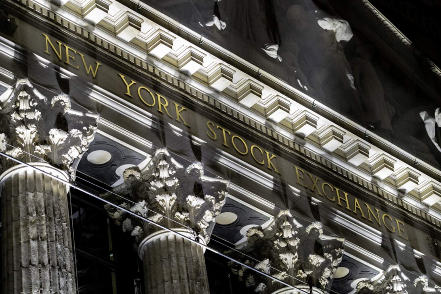 A January 2021 documentary photograph of the New York Stock Exchange name and columns on Broad Street, used to illustrate the October 7, 2026 U.S. after-close market report.